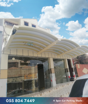 k span car parking shade on from of shop in dubai white and bage design
